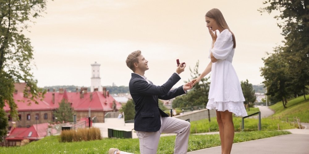 Couple sharing a romantic moment during a spring proposal